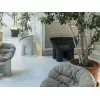 A Roly Poly armchair in a setting