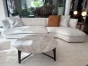 Flexform Quincy curved corner sectional sofa in light fabric at the Mobilificio Marchese showroom in Messina, Italy